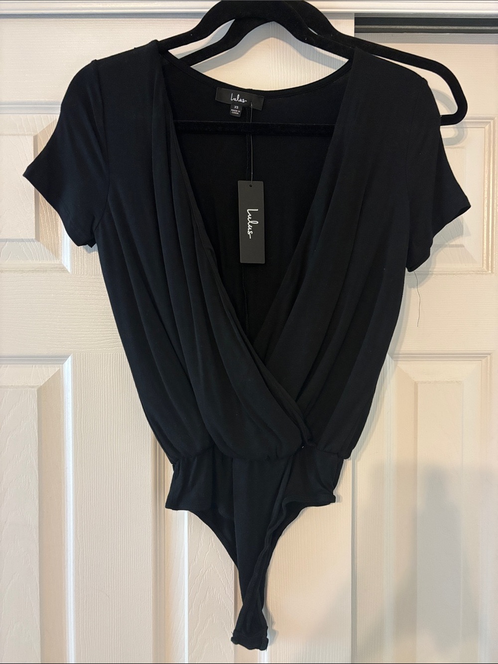 Lulu's Black Surplice Short-Sleeve Wrap Bodysuit